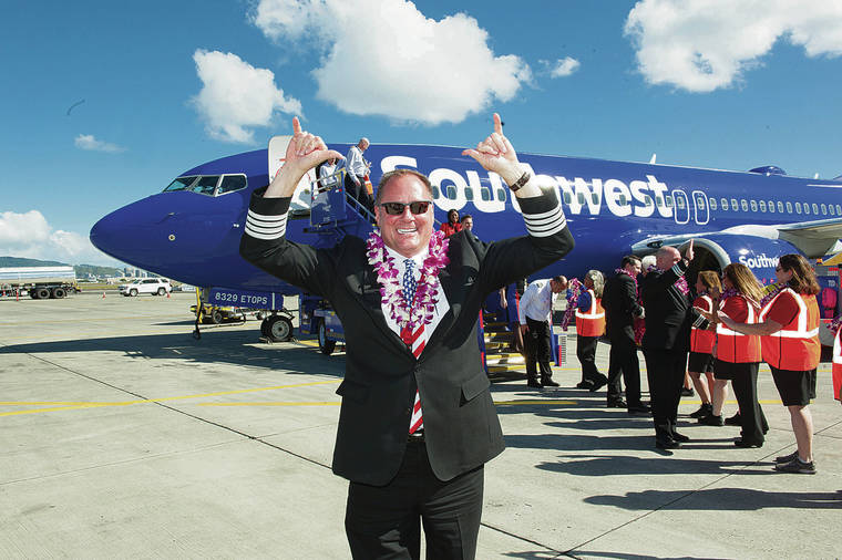 CRAIG T. KOJIMA / CKOJIMA@STARADVERTISER.COM
                                Southwest Airlines captain Scott van Ooyen flew first plane into Hawaii on Feb. 5.