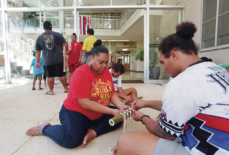 CINDY ELLEN RUSSELL / AUG. 27
                                Students who have been holding a sit-in at the Bachman Hall administration building at the University of Hawaii at Manoa since August say they plan to leave Friday for winter break. Students including Hulali Mohi, left, and Kaulana Stanley have participated in the sit-in in protest of the building of the Thirty Meter Telescope.