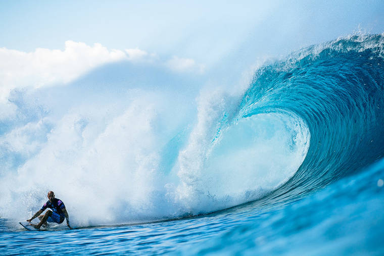ED SLOANE/WSL VIA GETTY IMAGES / DEC. 11
                                Kelly Slater catches a wave during the 2019 Billabong Pipe Masters today.