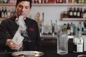 COURTESY REDFISH POKE BAR
                                Mixologist Matt Rosskopf fills a glass with smoke to make his Cane Fire cocktail. His specialties include the Rock Salt Plum, Momo­taro and Smokin’ Paloma.