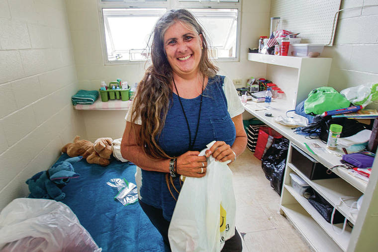 DENNIS ODA / DODA@STARADVERTISER.COM
                                The new homeless shelter, opened by Waikiki Health, can accommodate 76 people. Above, Lyla Reed settled into her new room.
