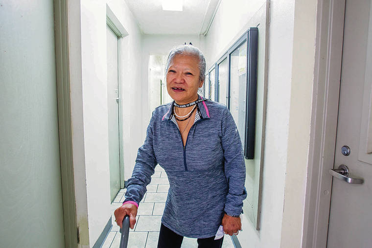 DENNIS ODA / DODA@STARADVERTISER.COM
                                New resident Sunim Haimoto, 65, walked the hallway Tuesday at Keauhou Shelter. The new homeless shelter, opened by Waikiki Health, can accommodate 76 people.