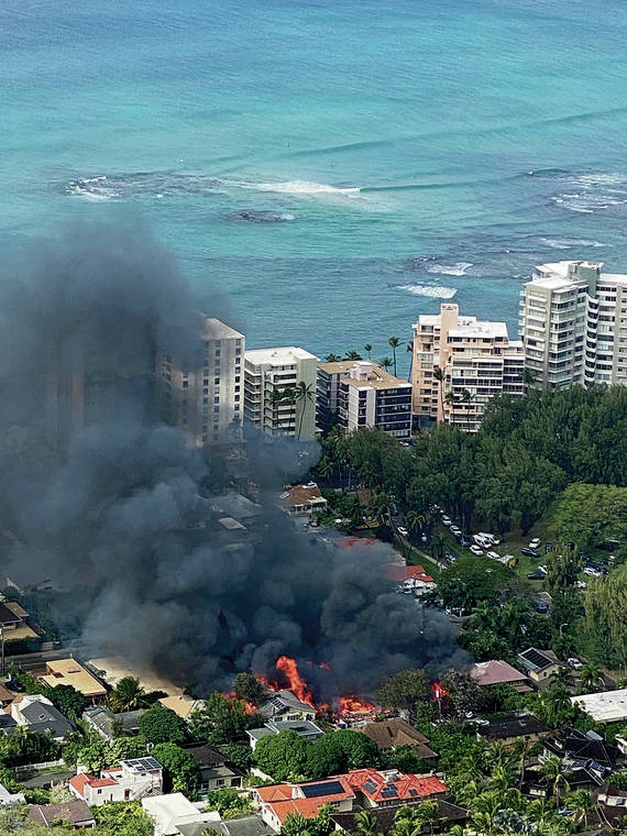 COURTESY SWAPNAL ACHARYA
                                A view from the top of Diamond Head of the fire that destroyed several homes.
