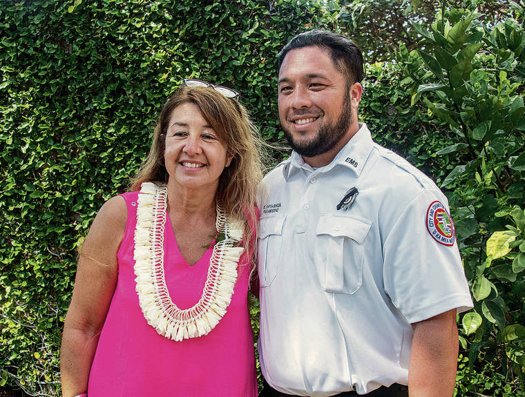 CRAIG T. KOJIMA / CKOJIMA@STARADVERTISER.COM
                                A luncheon was held Tuesday at La Pietra to honor first responders and residents of the Hibiscus Drive neighborhood. Above, Gisela Ricardi King stood with paramedic Kaipo Hayashida, who administered aid to her.