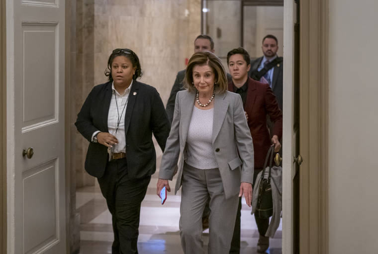 ASSOCIATED PRESS
                                Speaker of the House Nancy Pelosi, D-Calif., arrives at the Capitol in Washington on Friday.