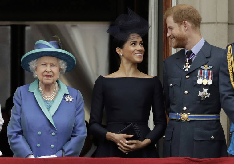 ASSOCIATED PRESS
                                Britain’s Queen Elizabeth II, Meghan the Duchess of Sussex and Prince Harry watched a flyby of Royal Air Force aircraft, in July 2018, over Buckingham Palace in London. Queen Elizabeth II agreed today to grant Prince Harry and and his wife Meghan their wish for a more independent life, allowing them to move part-time to Canada while remaining firmly in the House of Windsor.