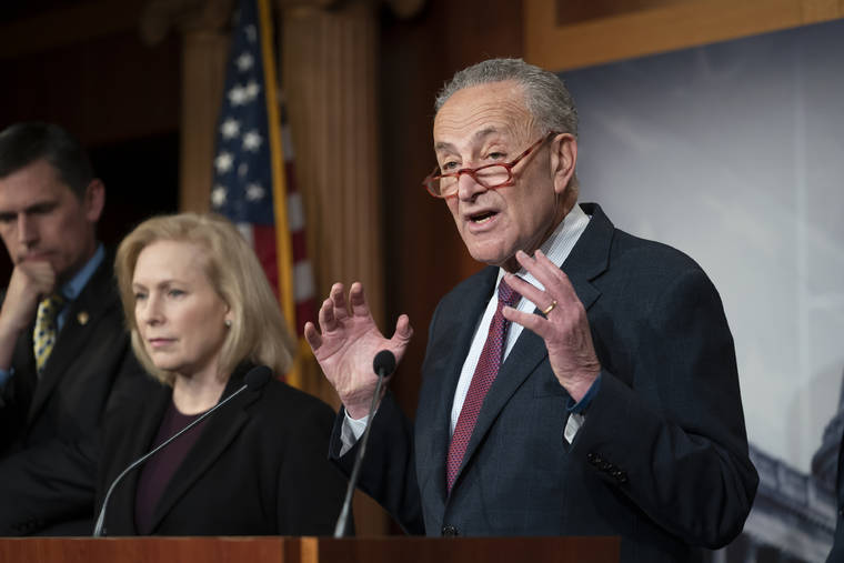 ASSOCIATED PRESS
                                Senate Minority Leader Chuck Schumer, D-N.Y., joined from left by Sen. Martin Heinrich, D-N.M., and Sen. Kirsten Gillibrand, D-N.Y., talked to reporters about the impeachment trial of President Donald Trump on charges of abuse of power and obstruction of Congress, in Washington, today.
