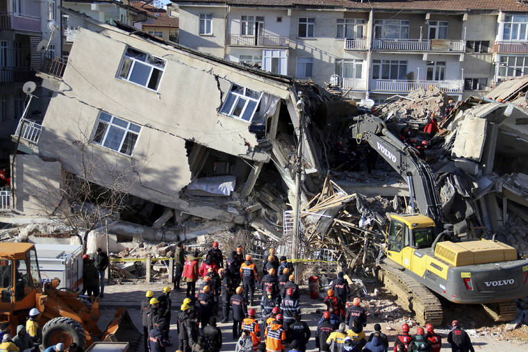 IHA VIA AP
                                Rescuers work on a collapsed building after a strong earthquake struck in Elazig in the eastern Turkey. The earthquake rocked eastern Turkey on Friday, causing some buildings to collapse and killing scores of people, Turkish officials said.