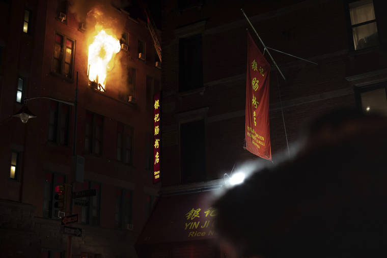 ASSOCIATED PRESS
                                Fire blows out of a window in the Chinatown section of New York. New York City firefighters battled a raging blaze at a building in the city’s Chinatown area Thursday night, Firefighters said they were called about 8:45 p.m. to 70 Mulberry Street for a fire on the fourth and fifth floors of the building, NYFD officials said.