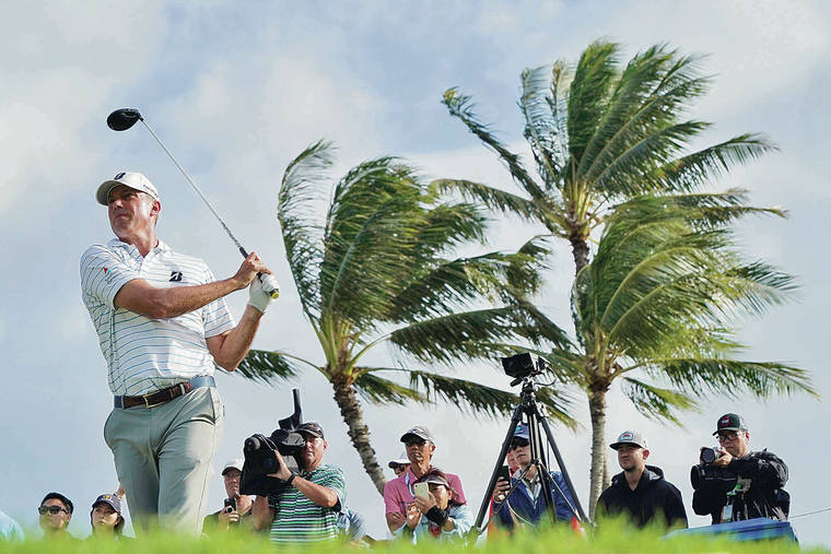 ASSOCIATED PRESS
                                Matt Kuchar hit from the 14th tee during the first round of the Sony Open on Thursday.