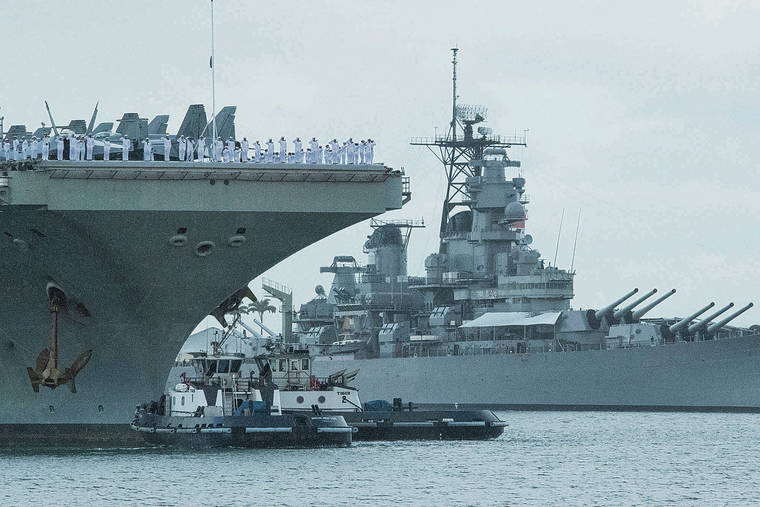 CRAIG T. KOJIMA / CKOJIMA@STARADVERTISER.COM
The USS Abraham Lincoln passed the USS Battleship Missouri Memorial as it arrived Wednesday at Pearl Harbor for a port call after a long deployment. The carrier will be stationed at its new home port in San Diego.