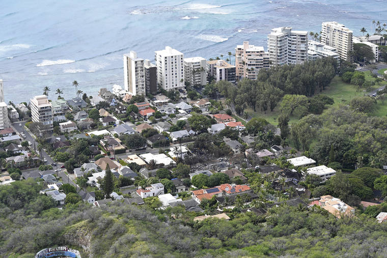 BRUCE ASATO / BASATO@STARADVERTISER.COM
                                The fire destruction along Hibiscus Drive is seen today from the top of Diamond Head. The damage is in the middle of the frame.