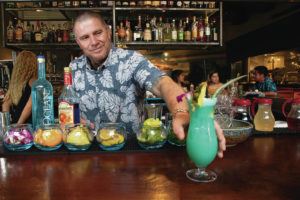 KAT WADE / SPECIAL TO THE STAR-ADVERTISER
                                Bartender Matt Howell prepares his original cocktail Oceans 12, a mix of Organic Vodka, Curacao, mango, lilikoi and lemonade.