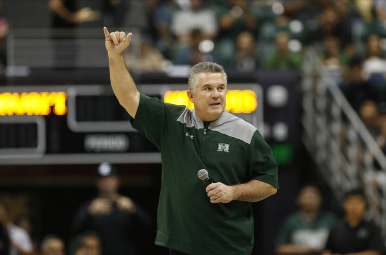 JAMM AQUINO/JAQUINO@STARADVERTISER.COM
                                Hawaii football head coach Todd Graham flashes a shaka to the crowd during a break in the first half of an NCAA basketball game at the Stan Sheriff Center earlier this month.
