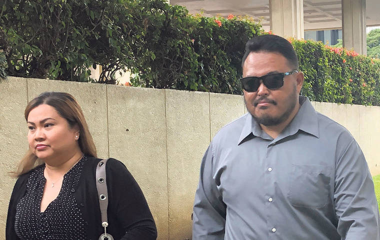 ASSOCIATED PRESS
                                Former Honolulu police officer Reginald Ramones, right, walks along Punchbowl Street in Honolulu on Sept. 25. Ramones has pleaded guilty to failing to report that another police officer forced a homeless man to lick a public urinal.