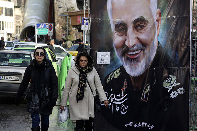 ASSOCIATED PRESS / Jan. 9
                                Women walk past a banner of Iranian Revolutionary Guard Gen. Qassem Soleimani, who was killed in Iraq in a U.S. drone attack, in Tehran, Iran last month.