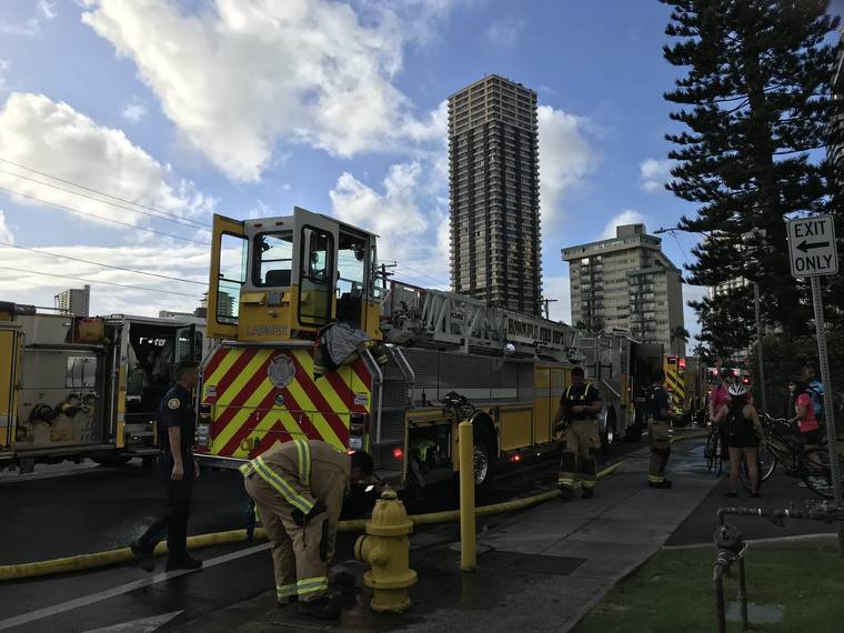 DENNIS ODA / DODA@STARADVERTISER.COM Honolulu firefighters responded to a condo fire this morning on McCully Street.