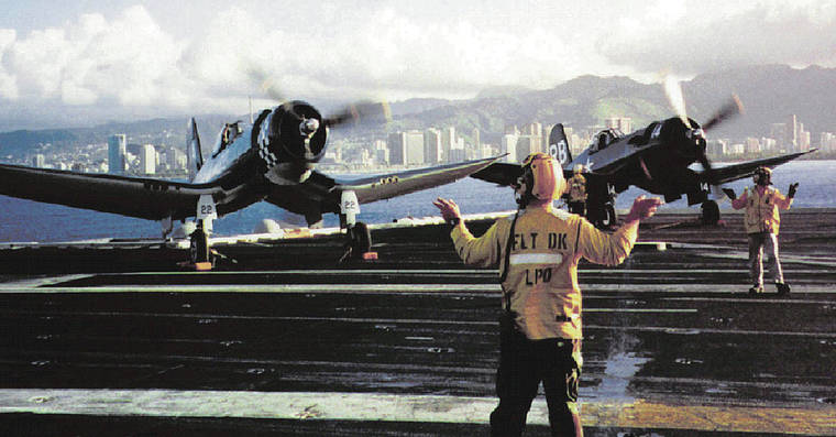 COURTESY JOHN BOND
                                Two F4U Corsairs warmed up while a B-25 Mitchell bomber, headed off the carrier USS Carl Vinson in 1995 off Oahu.
