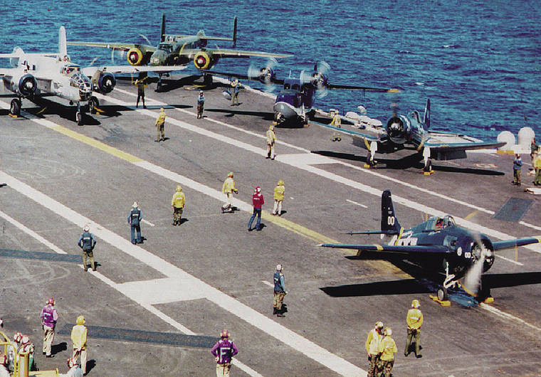 COURTESY JOHN BOND / 1995
                                Vintage warbirds line the deck of the aircraft carrier USS Carl Vinson off Oahu for the 50th anniversary of the end of WWII.
