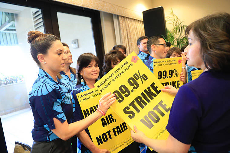 JAMM AQUINO / JAQUINO@STARADVERTISER.COM
                                Hawaiian Airlines employees appear at a press conference today at the Hilton Hawaiian Village about bargaining between Hawaiian Airlines management and flight attendants.