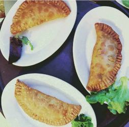 COURTESY COQUITO’S LATIN CUISINE AND BARRIO CAFE
                                Chef Stevina Kiyabu of Coquito’s Latin Cuisine in Waianae is preparing empanadillas with a pork pastele stuffing for a pop-up Latin dinner Feb. 29. At left, enmoladas by Miriam Olivas of Barrio Cafe are also on the menu.