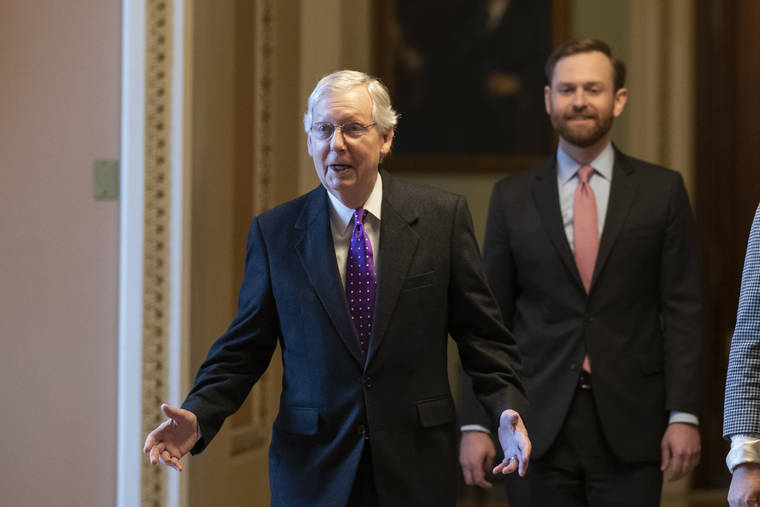 ASSOCIATED PRESS
                                Senate Majority Leader Mitch McConnell of Ky., left, walked from the Senate Floor on Capitol Hill, today, in Washington.