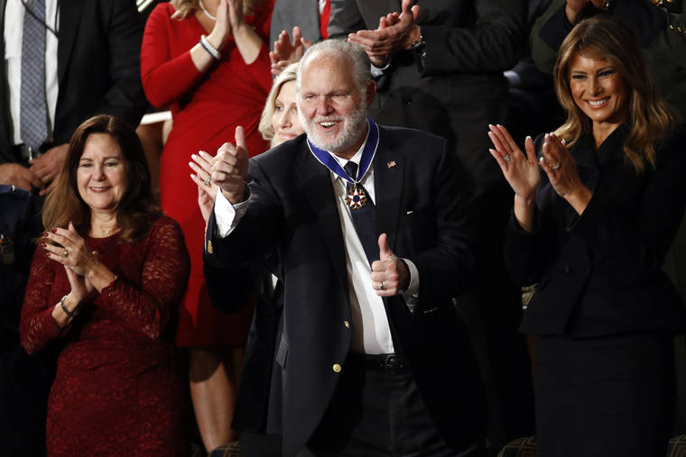 ASSOCIATED PRESS
                                Rush Limbaugh reacts after first Lady Melania Trump presented him with the the Presidential Medal of Freedom as President Donald Trump delivers his State of the Union address to a joint session of Congress on Capitol Hill in Washington.