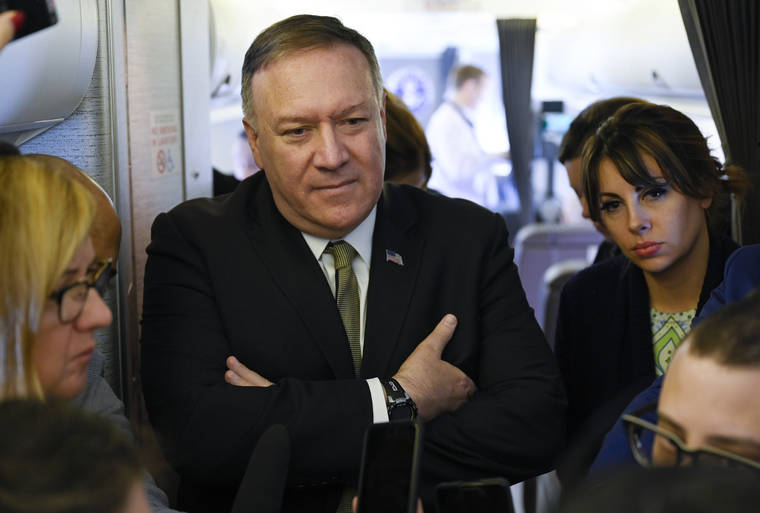 ASSOCIATED PRESS
                                Secretary of State Mike Pompeo takes questions from reporters during a flight from Andrews Air Force Base, Md., to Germany on Thursday.