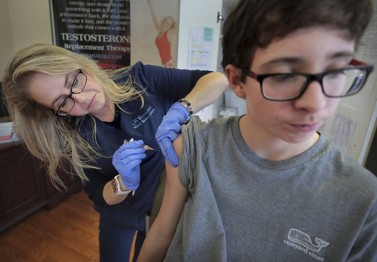 Jim Weber/Daily Memphian via AP / 2019
                                Wendy Kerley gives Ethan Getman, 15, a shot of the flu vaccine at the Cordova Shot Nurse clinic in Memphis, Tenn. A second wave of flu is hitting the U.S., turning this into one of the nastiest flu seasons for children in a decade.