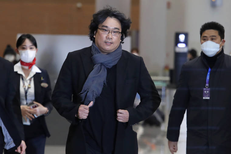 ASSOCIATED PRESS
                                South Korean director Bong Joon-ho arrives at the Incheon International Airport in Incheon, South Korea, today. South Koreans are reveling in writer-director Bong’s dark comic thriller, “Parasite,” which won this year’s Academy Awards for best film and best international feature. The movie itself, however, doesn’t put the country in a particularly positive light.