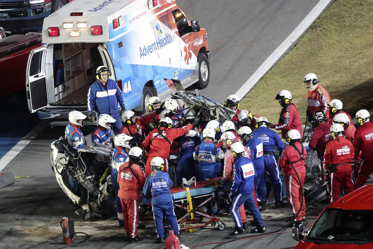 ASSOCIATED PRESS
                                Rescue workers removed Ryan Newman from his car after he was involved in a wreck on the last lap of the NASCAR Daytona 500 auto race at Daytona International Speedway, Monday, in Daytona Beach, Fla.