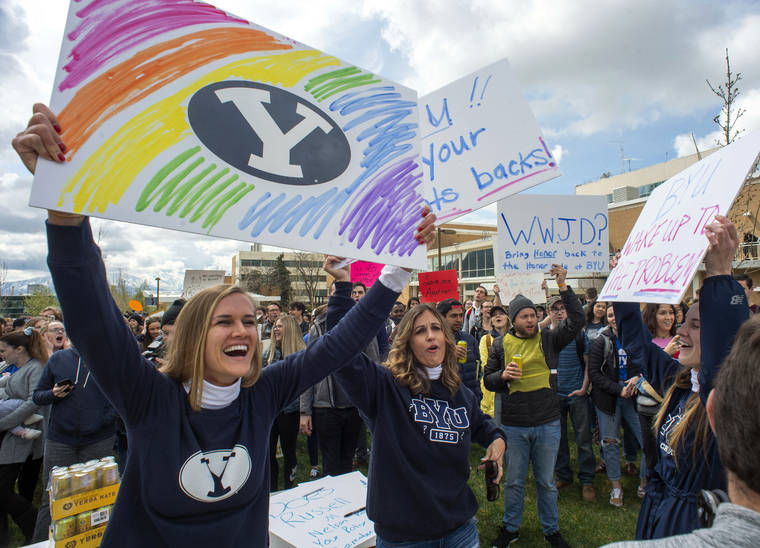 ASSOCIATED PRESS / APRIL 12, 2019
                                Sidney Draughon holds a sign as she takes part in a protest in Provo, Utah, against how the Brigham Young University Honor Code Office investigates and disciplines students. Brigham Young University in Utah has revised its strict code of conduct to strip a rule that banned any behavior that reflected “homosexual feelings.”