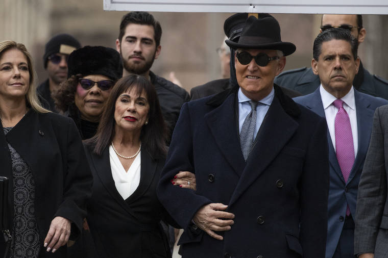 ASSOCIATED PRESS Roger Stone was accompanied by his wife Nydia Stone, second from left, arrives at federal court in Washington, today. Stone, a staunch ally of President Donald Trump, was sentenced today on his convictions for witness tampering and lying to Congress.