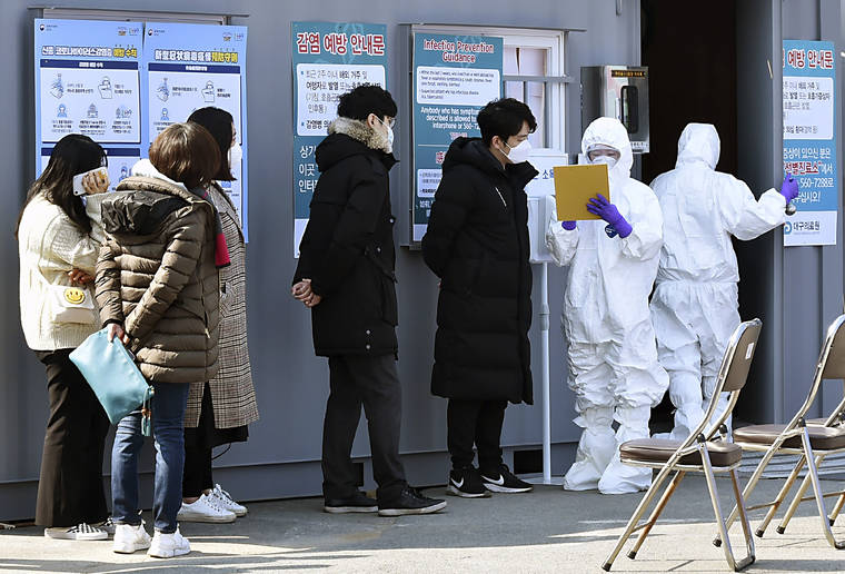 LEE MOO-RYUL/NEWSIS VIA ASSOCIATED PRESS
                                People suspected of being infected with the new coronavirus waited to receive tests at a medical center in Daegu, South Korea, Thursday. The mayor of the South Korean city of Daegu urged its 2.5 million people on Thursday to refrain from going outside as cases of a new virus spiked and he pleaded for help from the central government.