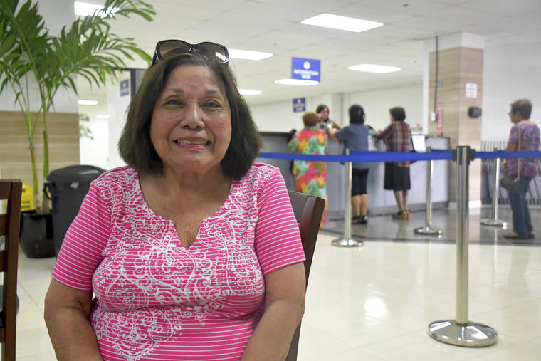 ASSOCIATED PRESS
                                Antonina Palomo Cross, 85, sat at the Guam war claims office, Feb. 7, in Tamuning, Guam after getting confirmation that she will receive a payment for her experience living through the Japanese occupation of the U.S. Pacific island territory in 1941.