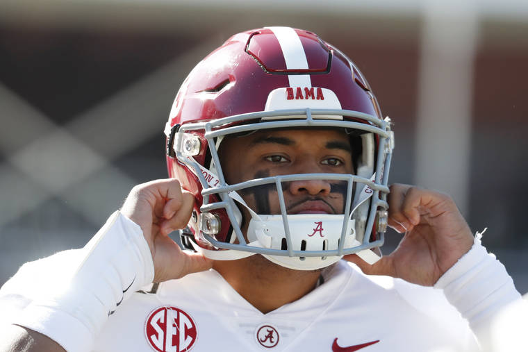 ASSOCIATED PRESS
                                Alabama quarterback Tua Tagovailoa adjusts his helmet before the first half of a game against Mississippi State in Starkville, Miss., on Nov. 16.