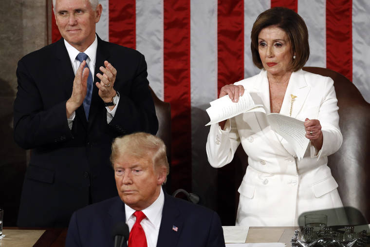 ASSOCIATED PRESS
                                House Speaker Nancy Pelosi of Calif., tears her copy of President Donald Trump’s s State of the Union address after he delivered it to a joint session of Congress on Capitol Hill in Washington, today. Vice President Mike Pence is at left.