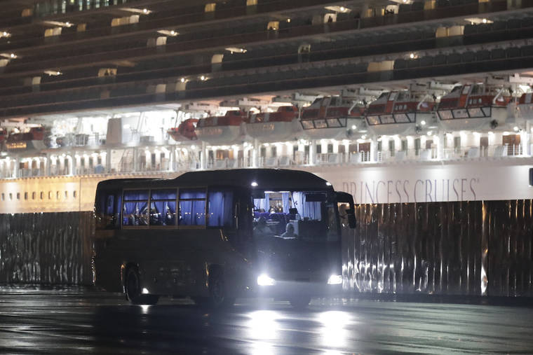 ASSOCIATED PRESS
                                Buses carrying American passengers from the quarantined Diamond Princess cruise ship leave a port in Yokohama, Japan, on Monday.