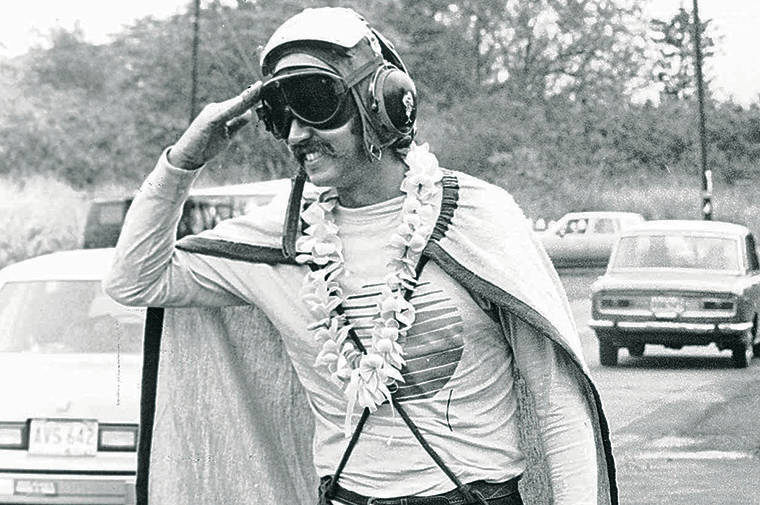 STAR-ADVERTISER / DEC. 30, 1983
                                Pilot Rick Rogers protested demolition of Haleiwa Theater dressed as Captain Haleiwa.