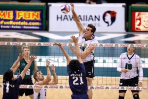 ANDREW LEE / Special to the Star-Advertiser
                                Hawaii’s Patrick Gasman (15) slams down a point over Nittaidai’s Shuto Kawaguchi (21) during the first set of an Exhibition Men’s Volleyball match on Wednesday, at the Stan Sheriff Center.