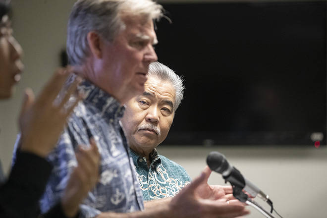 CINDY ELLEN RUSSELL / CRUSSELL@STARADVERTISER.COM
                                Hawaii Health Director Bruce Anderson speaks to reporters as Gov. David Ige, right, looks at the state Department of Health today. Ige announced that testing has confirmed Hawaii first case of the new coronavirus known as COVID-19.