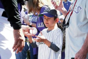 ASSOCIATED PRESS
                                A young Colorado Rockies fan gets an autograph from manager Bud Black prior to a spring training baseball game against the Chicago Cubs Tuesday, in Scottsdale, Ariz.