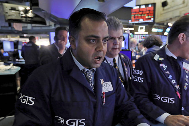 ASSOCIATED PRESS
                                Specialist Dilip Patel, left, works at his post on the floor of the New York Stock Exchange today. The Dow Jones Industrial Average sank 7.8%, its steepest drop since the financial crisis of 2008, as a free-fall in oil prices and worsening fears of fallout from the spreading coronavirus outbreak seize markets.