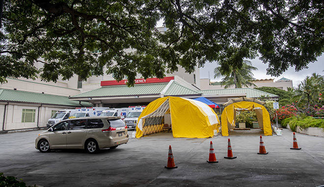 DENNIS ODA /DODA@STARADVERTISER.COM
                                Tents were put up outside the Queen’s Medical Center emergency entrance to evaluate and potentially test “walking well” patients for the novel coronavirus while keeping them separated from emergency room patients.