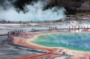 LOS ANGELES TIMES / TRIBUNE NEWS SERVICE
                                Crowds of visitors on the wooden walkways at the Midway Geyser Basin walk through the steam clouds around the colorful Grand Prismatic Spring in Yellowstone National Park on July 23, 2015.