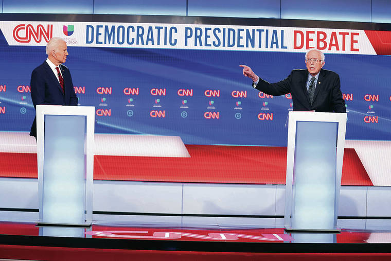 ASSOCIATED PRESS
                                Former Vice President Joe Biden, left, and Vermont Sen. Bernie Sanders debated each other March 15 at CNN Studios in Washington. The location had been changed and audience canceled due to the coronavirus outbreak.