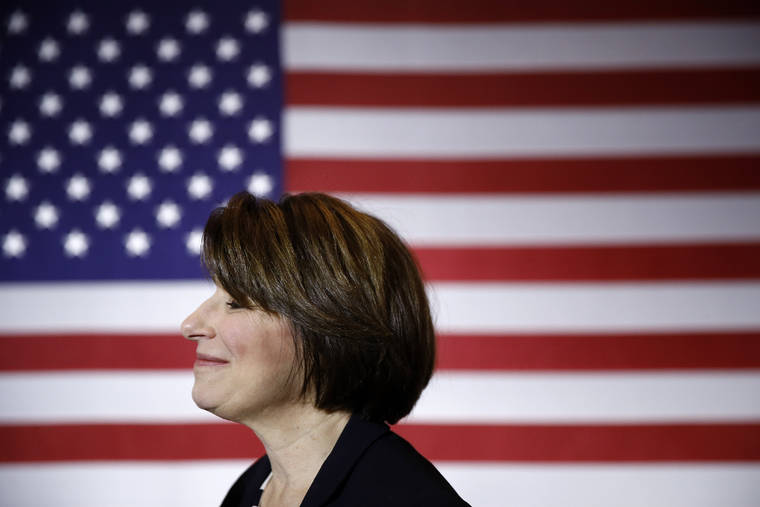 ASSOCIATED PRESS
                                Democratic presidential candidate Sen. Amy Klobuchar, D-Minn., visited, Jan. 10, with attendees after speaking at a campaign event in Cedar Rapids, Iowa.
