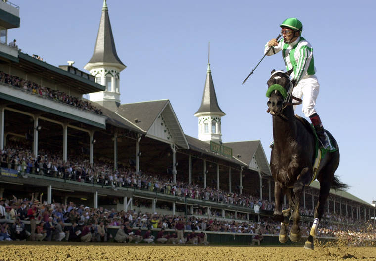 ASSOCIATED PRESS
                                Jockey Victor Espinoza celebrates after riding War Emblem to victory in the 128th Kentucky Derby horse race at Churchill Downs in Louisville, Ky., in 2002. War Emblem, the 2002 Kentucky Derby and Preakness winner, died today at the age of 21.