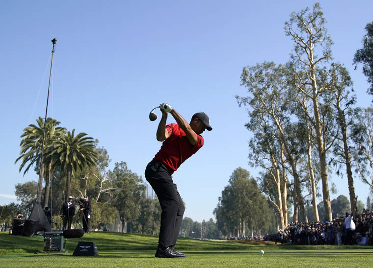 ASSOCIATED PRESS
                                Tiger Woods tees off on the 12th hole during the final round of the Genesis Invitational golf tournament at Riviera Country Club, Feb. 16, in the Pacific Palisades area of Los Angeles.