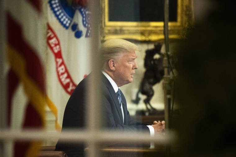 ASSOCIATED PRESS
                                President Donald Trump addresses the nation from the Oval Office at the White House, Wednesday, in Washington.